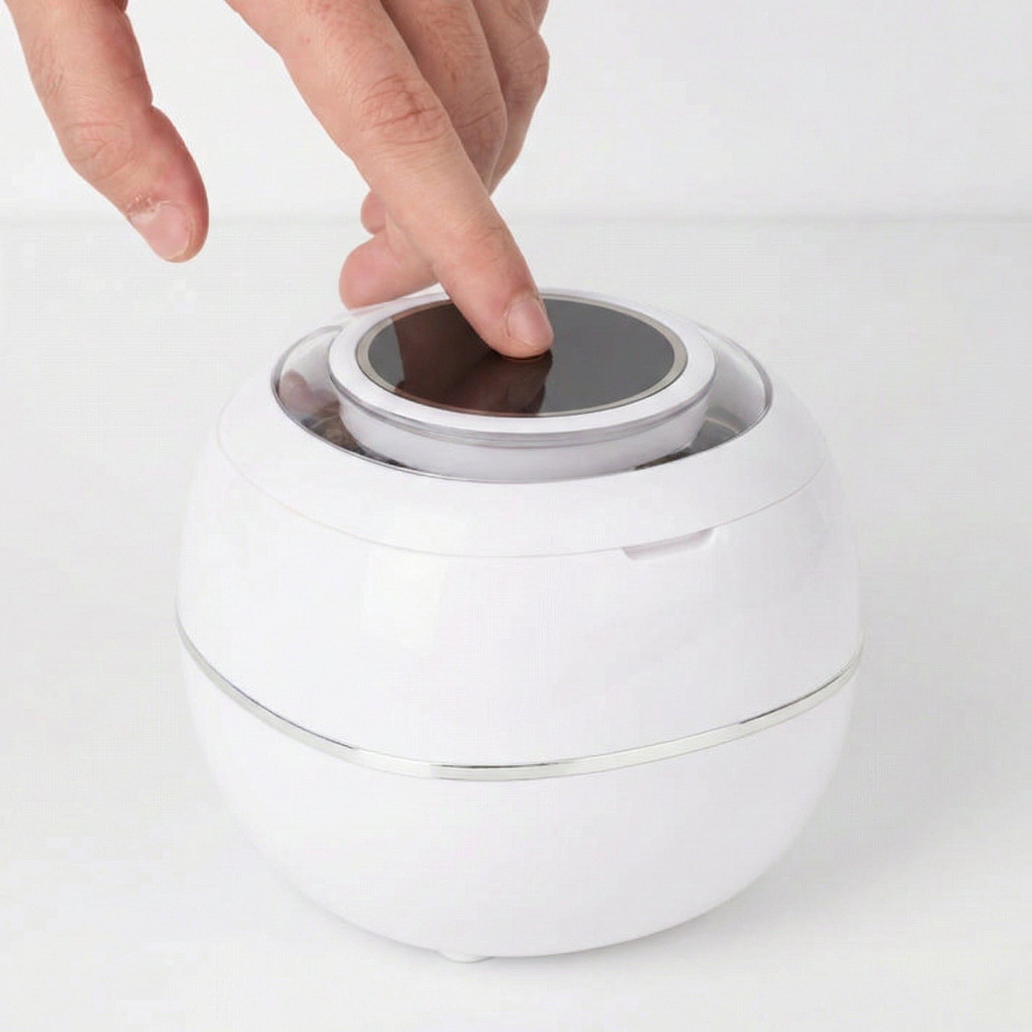 Pressing the PureDental Cleaner's power button