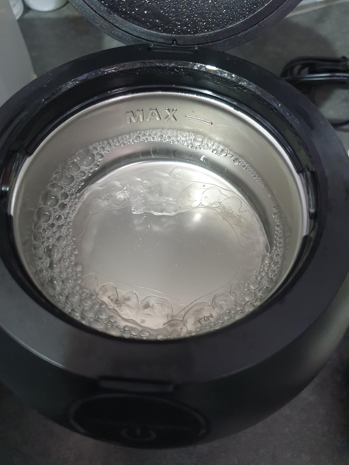 A customer's PureDental Cleaner with an aligner