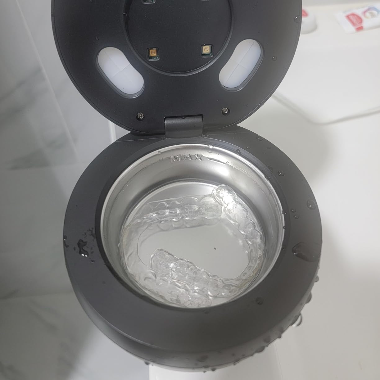 A PureDental Cleaner with its lid open