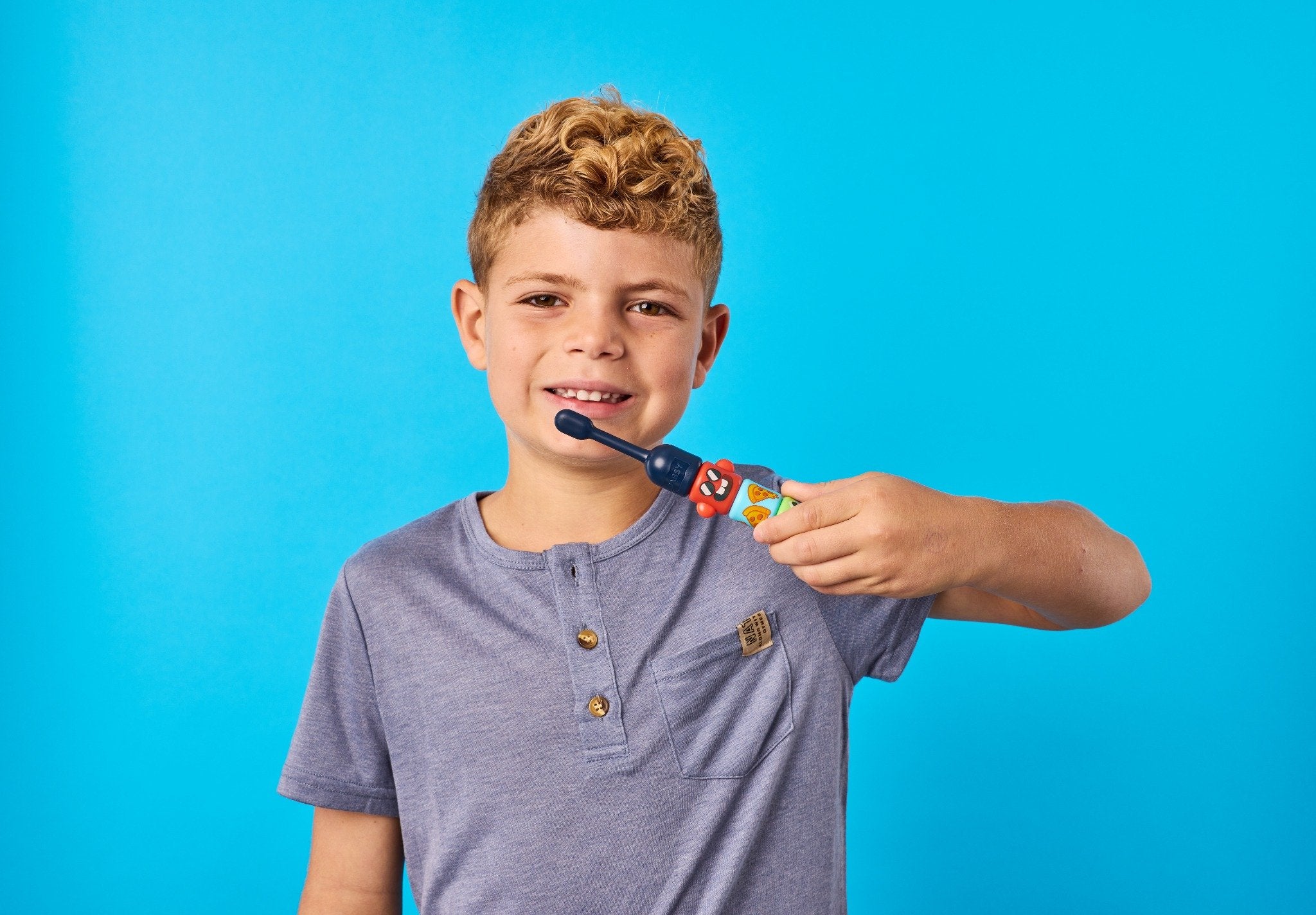 A Babsy Build-A-Brush toothbrush built from colorful twist-on bits