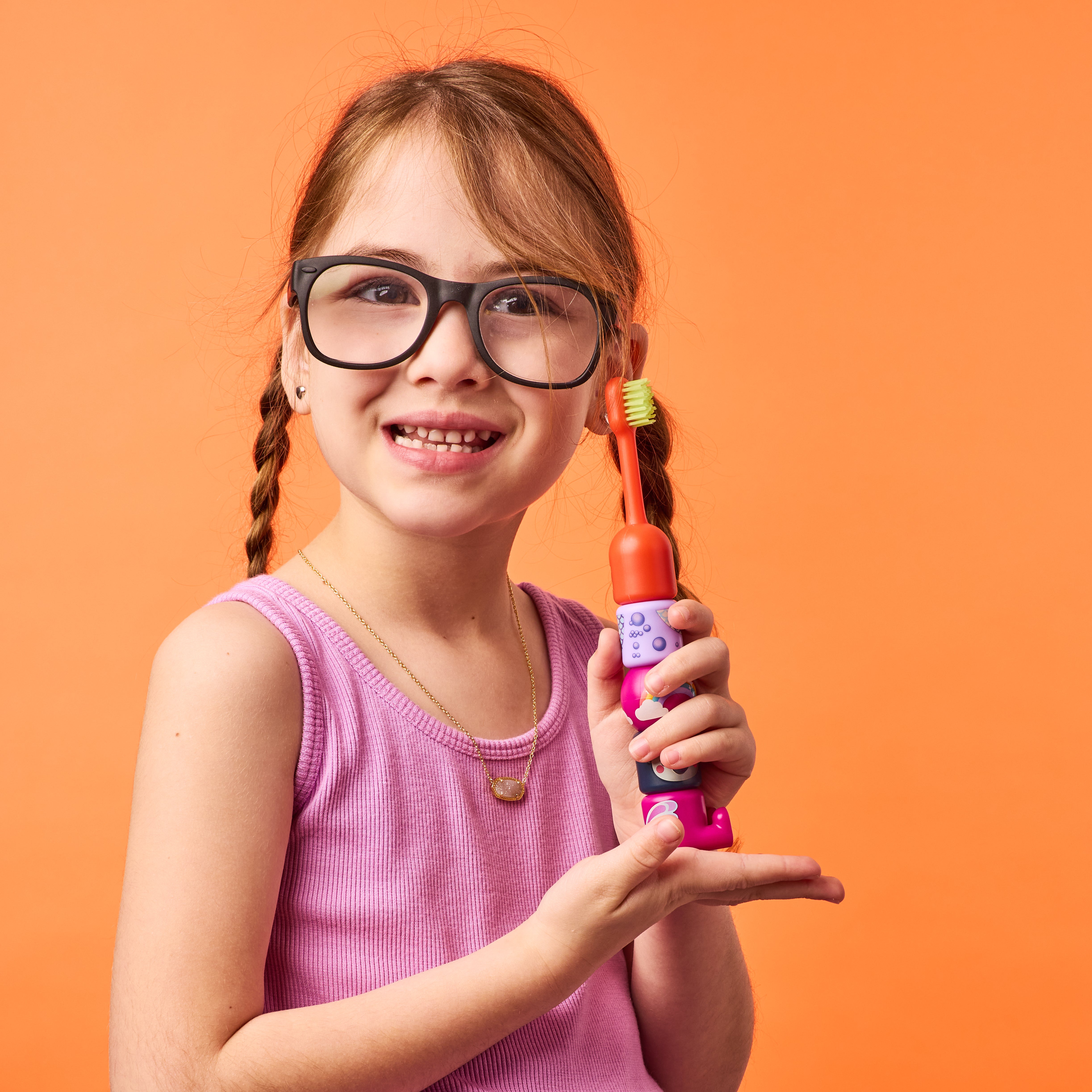 A child brushing with their Babsy Build-A-Brush
